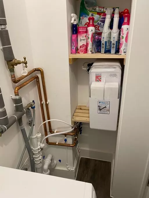 Fitting into a utility cupboard within a Dartford flat